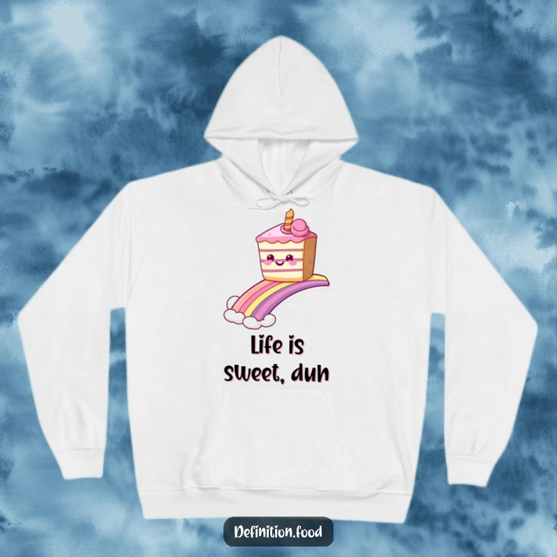 Cozy funny grinning cake hoodie sliding down a rainbow, perfect for staying warm with sweet humor. Ideal funny gift.